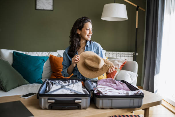 Woman packing clothes for travel